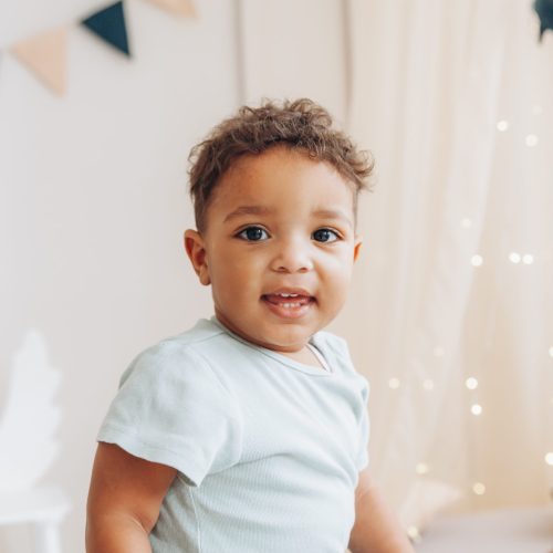 cute-little-african-american-boy-sits-highchair-shape-elephantchildrens-room-design-scaled.jpg